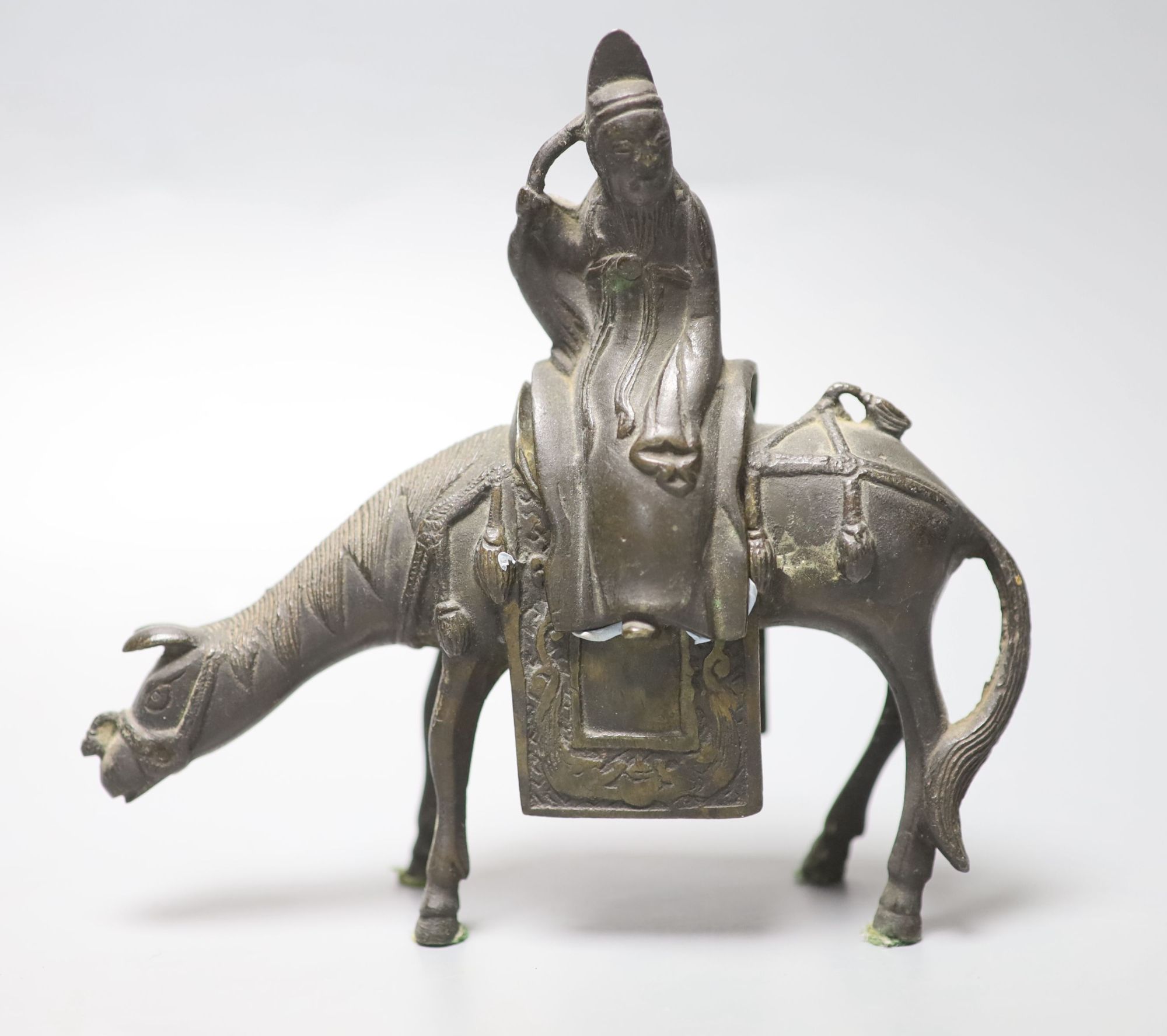 A 17th century Chinese bronze sage riding a horse censer, 15.2cm high